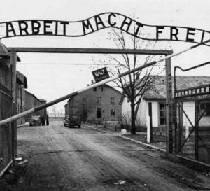 Gate at Auschwitz that reads "Arbeit Macht Frei" (Work Makes You Free)