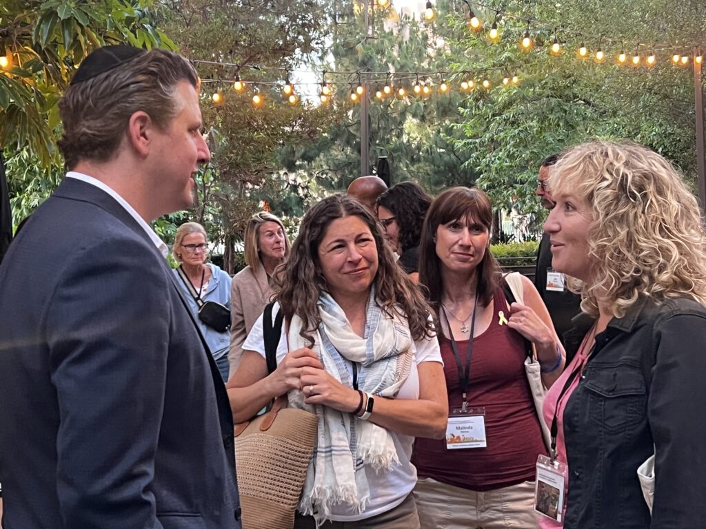 State Senator Henry Stern (CA-27) spoke with attendees after delivering welcome remarks at the 2025 Summer Institute.